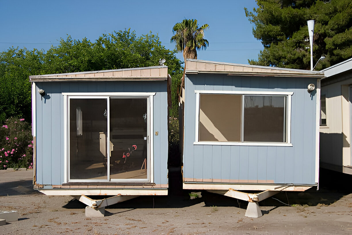 Modular home addition units placed side by side, ready for installation