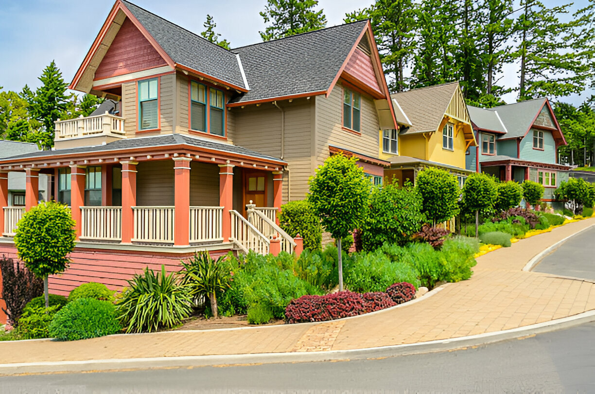 Colorful row of charming suburban homes with manicured landscaping