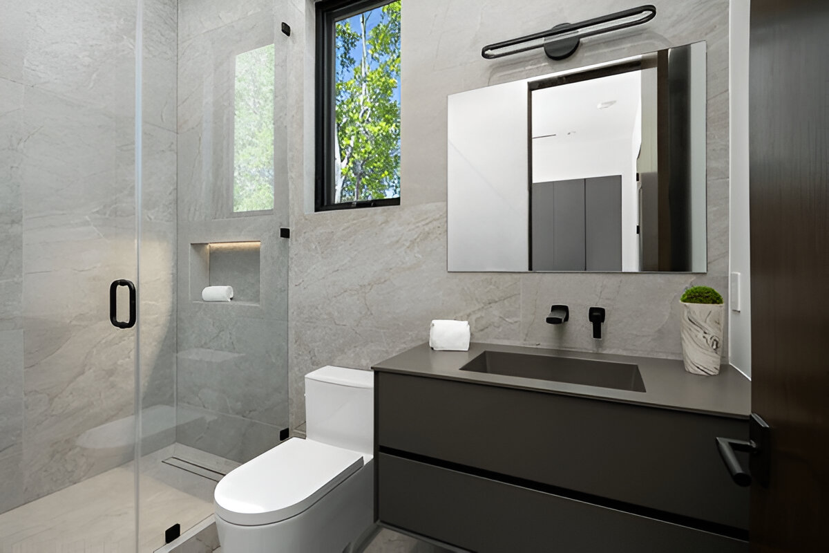 Modern bathroom with walk-in shower and dark floating vanity