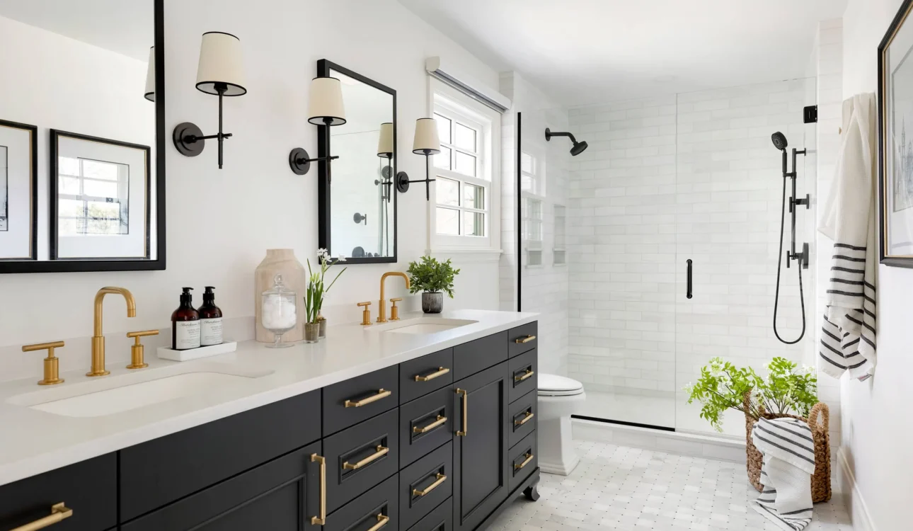 Modern bathroom with black vanity and glass shower enclosure