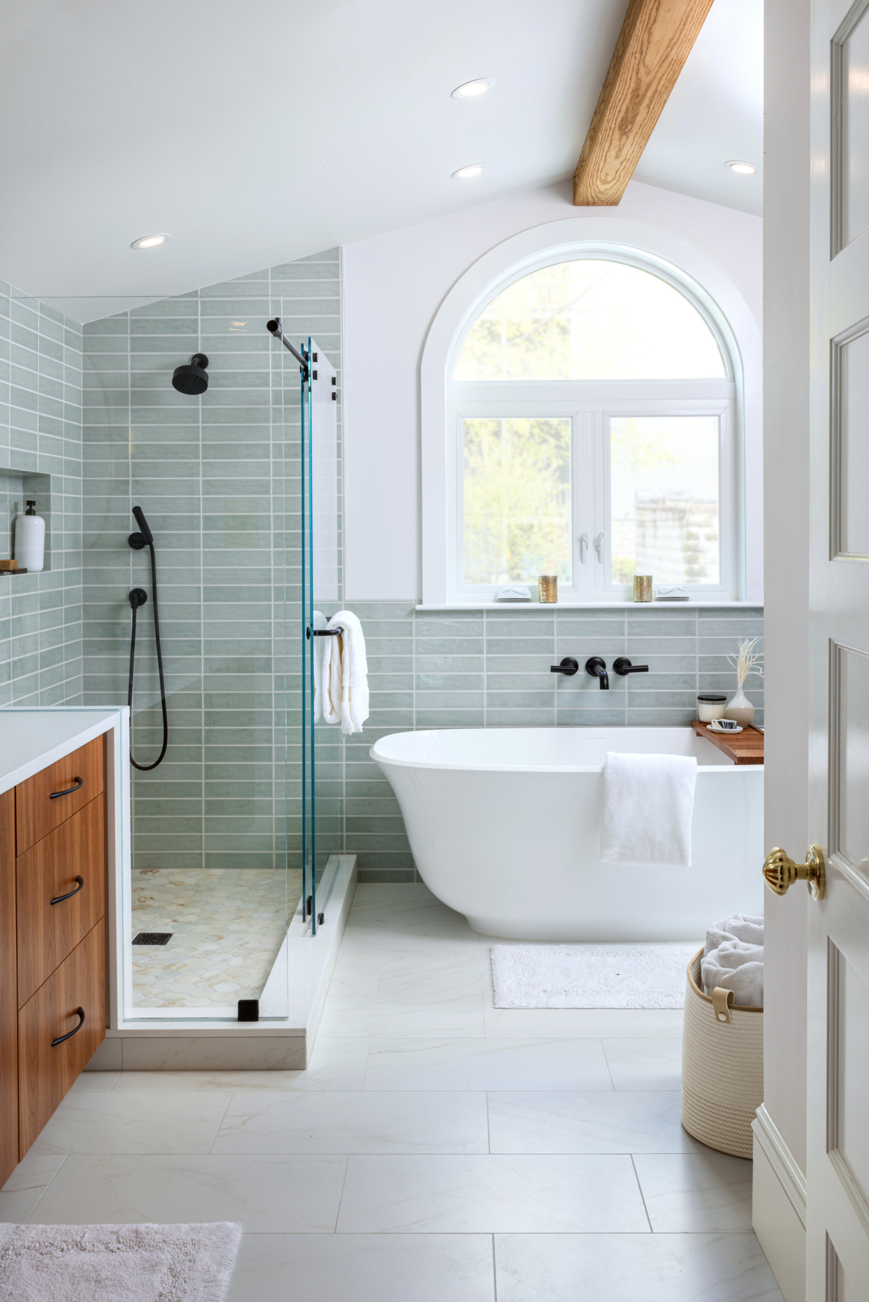Bright bathroom with walk-in shower and freestanding tub