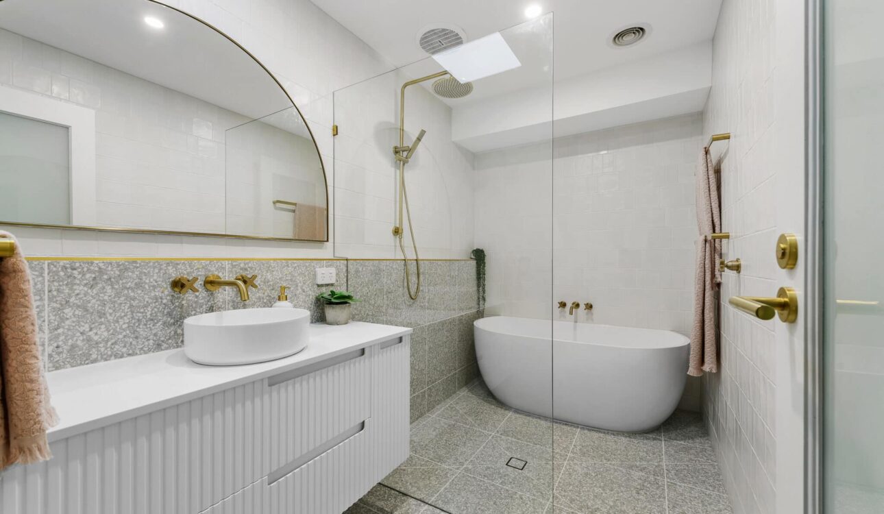 Modern bathroom with freestanding tub and glass shower enclosure