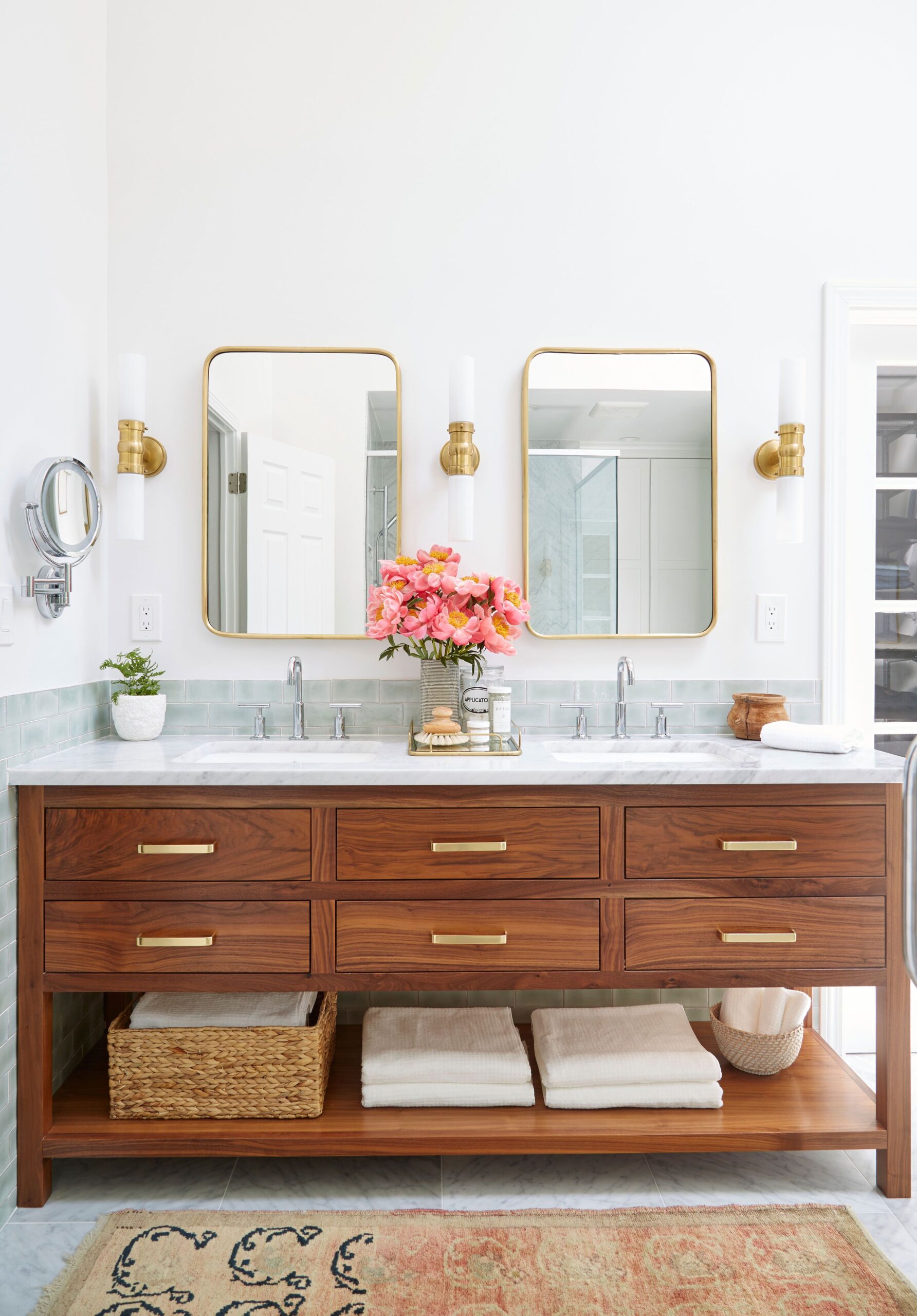 Elegant bathroom vanity with wooden cabinets and double mirrors