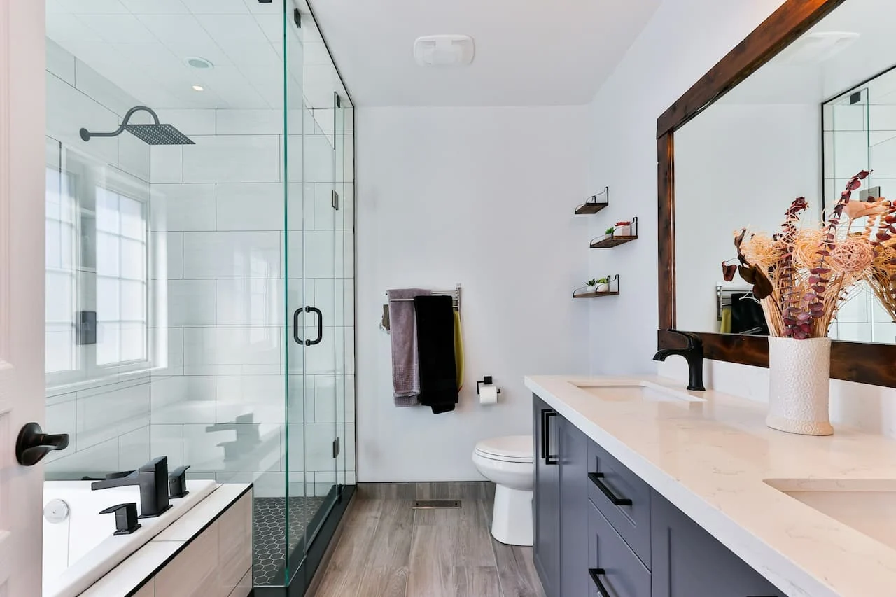 Modern bathroom with glass shower enclosure and double vanity