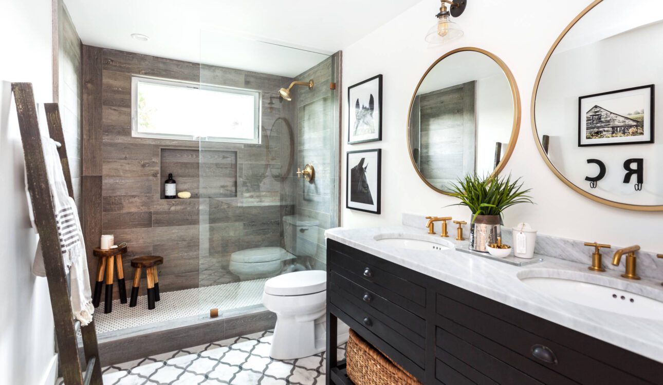 Farmhouse style bathroom with wood accents and glass shower