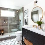 Farmhouse style bathroom with wood accents and glass shower