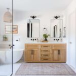 Bright bathroom with wooden vanity and freestanding bathtub