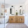 Bright bathroom with wooden vanity and freestanding bathtub
