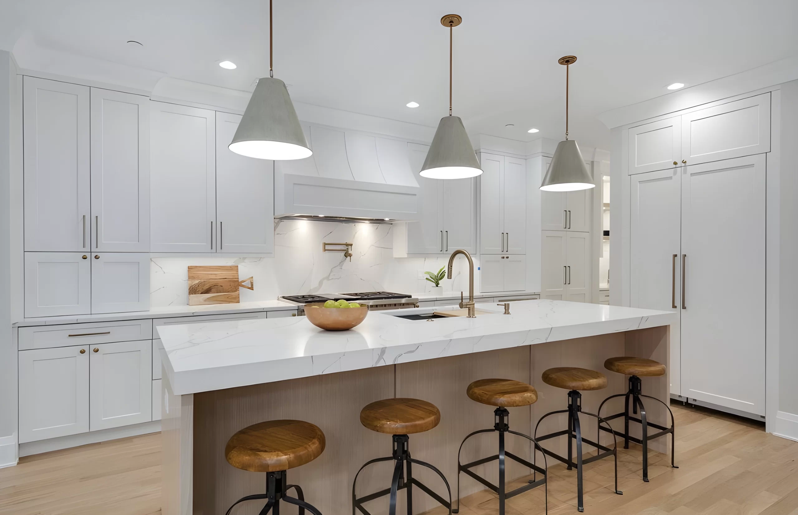 Modern white kitchen with marble island and wooden bar stools