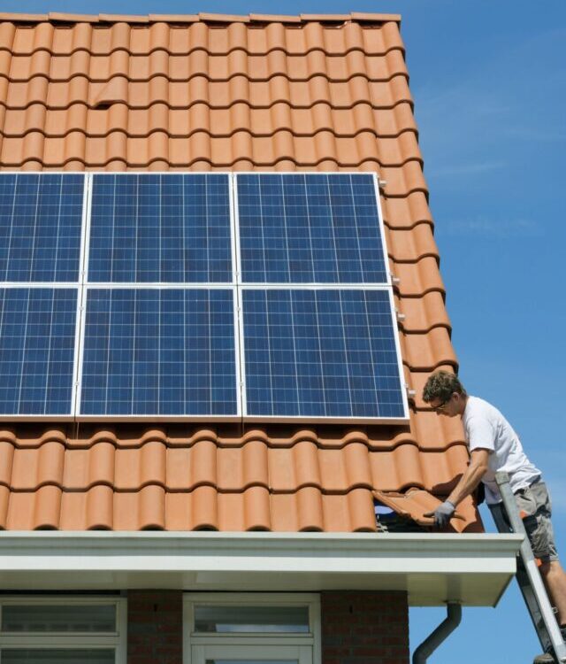 worker-checking-installation-of-solar-panels-on-royalty-free-image-507828519-1564243402