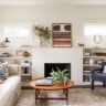 Cozy modern living room with neutral tones, mid-century furniture, and built-in shelving.